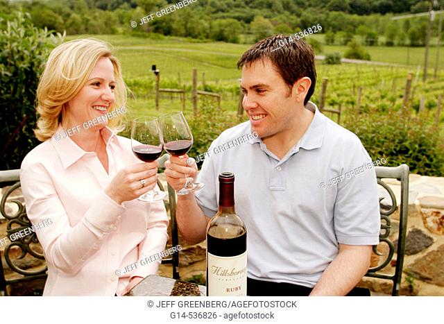Virginia, Hillsboro, Hillsborough Winery, wine bottle, glasses, couple toasting, vineyard