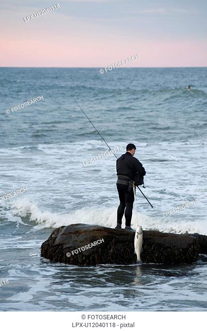 People fishing off the Hampton shoreline