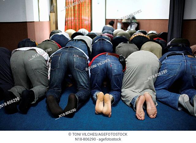 Men praying during Ramadan, Girona. Catalonia, Spain