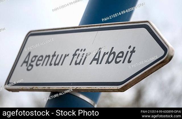 06 May 2021, Saxony-Anhalt, Sangerhausen: ""Agentur für Arbeit"" is written on a signpost in front of the authority in Sangerhausen