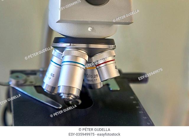Microscope lens closeup in a lab