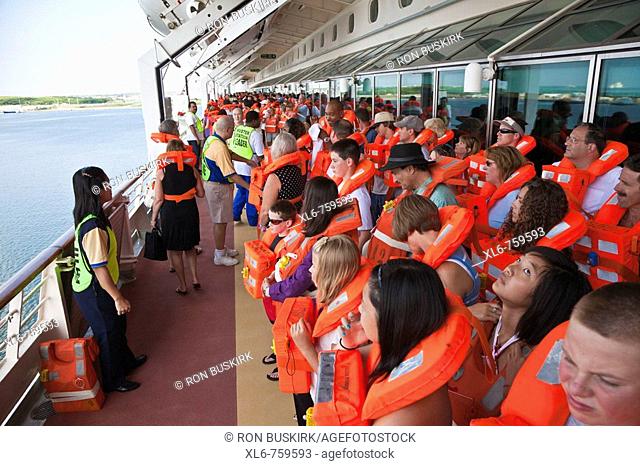 Cruise passengers participate in mandatory Muster Station drill prior to leaving the port at Cape Canaveral, Florida, USA