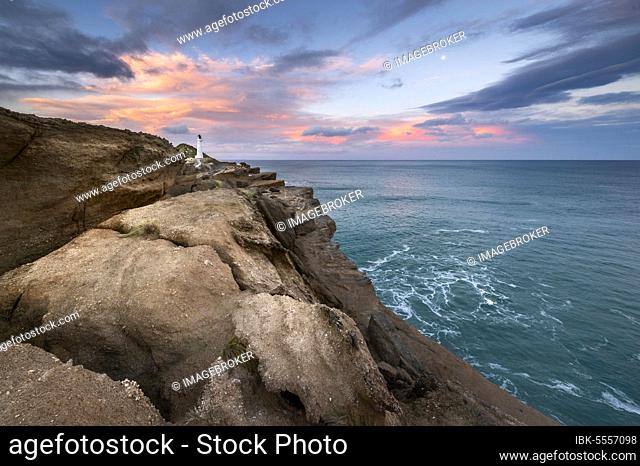 Lighthouse on the cliffs at Castlepoint, in the back turquoise ocean, Masterton, Wellington, New Zealand, Oceania