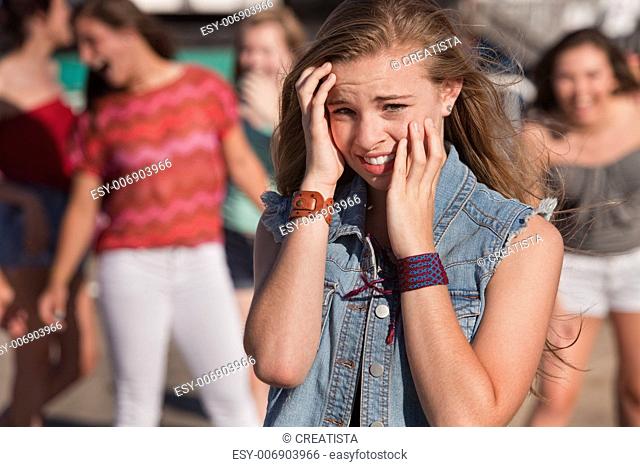 Teenagers Laughing at Scared Girl