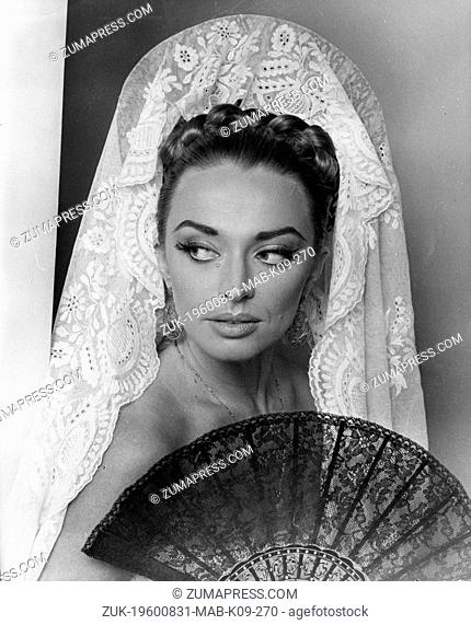 Aug. 31, 1960 - New York, NY, U.S. - In nine hours, make up man Douglas Young, of Max Factor, transformed actress APRIL ALRICH from an English maiden to a fiery...