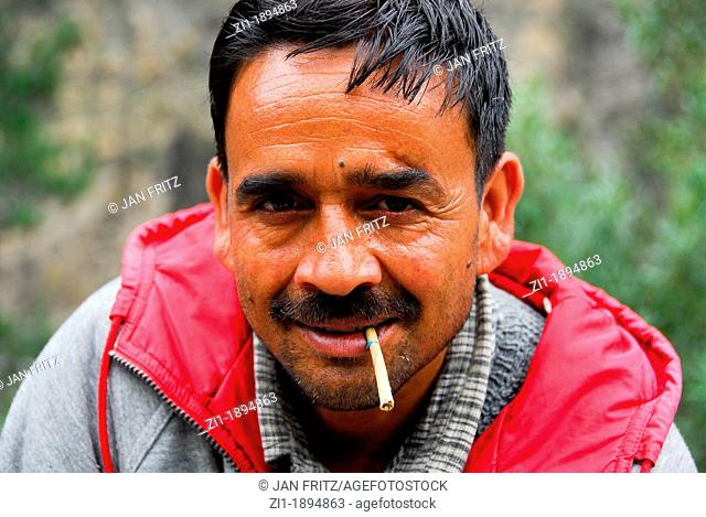 portrait of indian man with cigaret