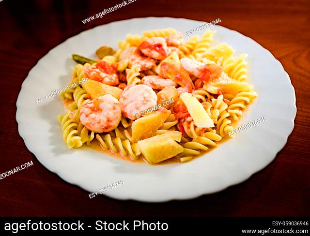 Seafood pasta in sweet and sour sauce. Asian style