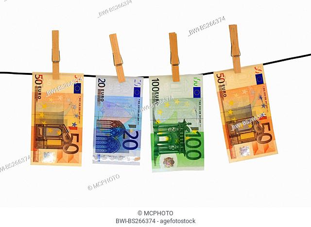 euro bills hanging at a wahing line