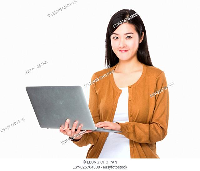 Asian Woman use of the notebook computer