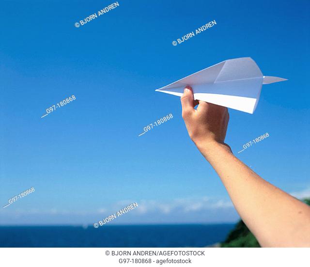 Hand with paper plane