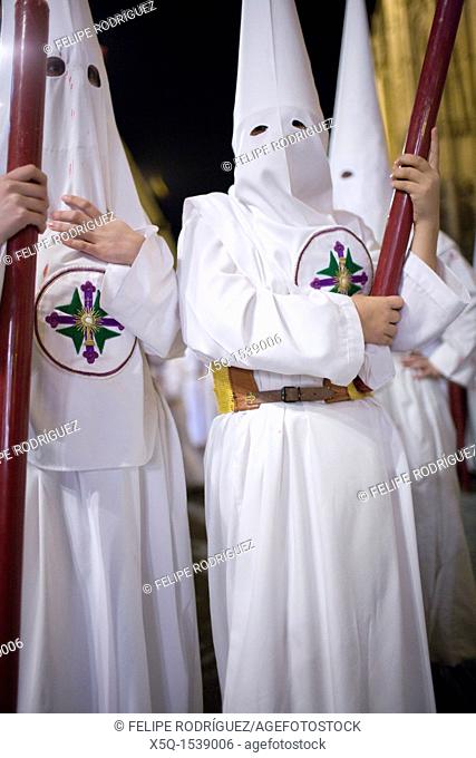 Young penitents bearing candles, Holy Week, Seville, Spain