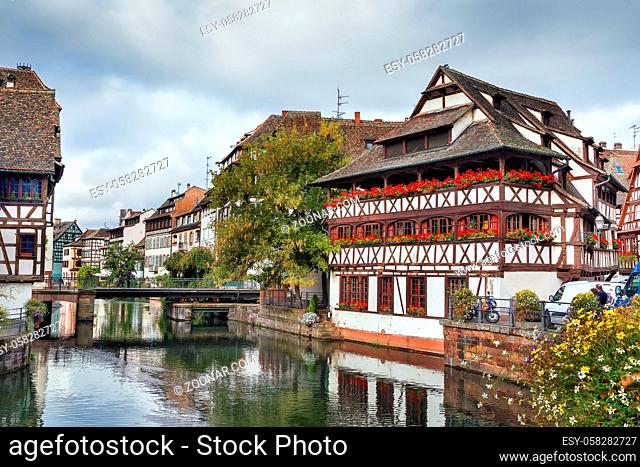View of embankment of the Ill river in Petite France district with Maison des Tanneurs (tanners house), Strasbourg, France