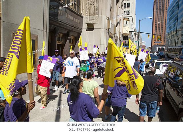 Detroit, Michigan - Janitors march through downtown Detroit, calling for a wage increase in their new union contract  The workers, who clean office buildings