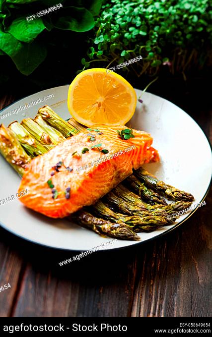 Salmon and asparagus with lemon and micro green, healthy food and lifestyle