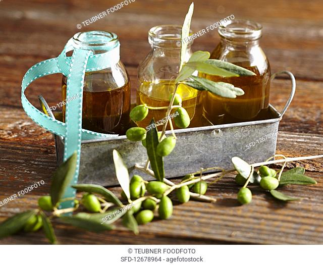 Various types of olive oil in glass bottles