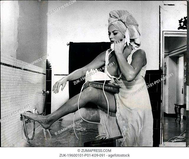 Dec. 12, 1965 - The Upsidedown-Ness Of 'Pyjama Story'A beautiful ANITA EKBERG carrying her new husband Peter Alexander across the threshold