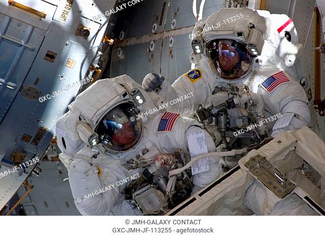 With components of the International Space Station in the view, NASA astronauts Andrew Feustel (right) and Michael Fincke are pictured during the STS-134...