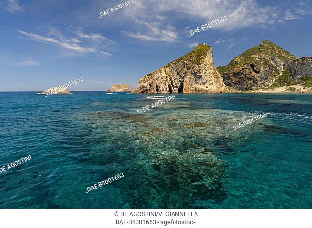 View of the Faraglione di San Silverio (stack) with Le Galere (crags) in the background, Palmarola, Pontine Islands, Lazio, Italy