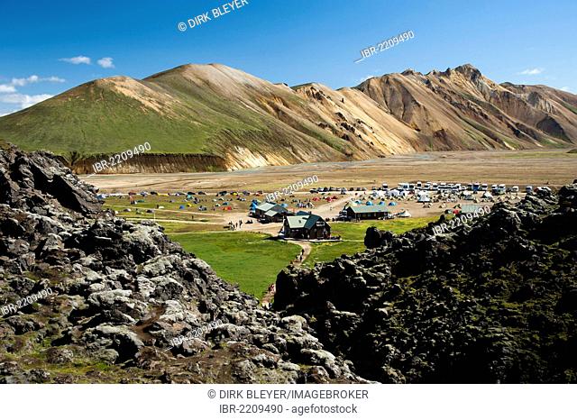A mountain cabin and a camping site in Landmannalaugar, Laugahraun lava field and rhyolite mountains on the Laugavegur hiking trail