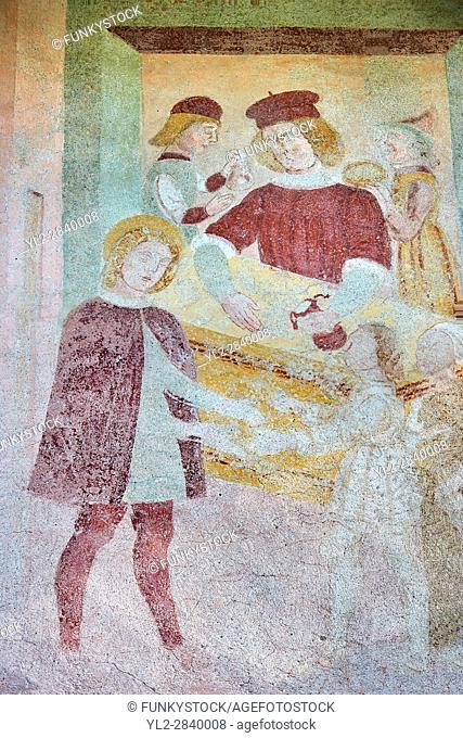 Religious murals depicting the Life of St Antonio Abate by Dionisio Baschenis ( circa 1493) on the exterior of the Gothic Church of San Antonio Abate, Pelugo