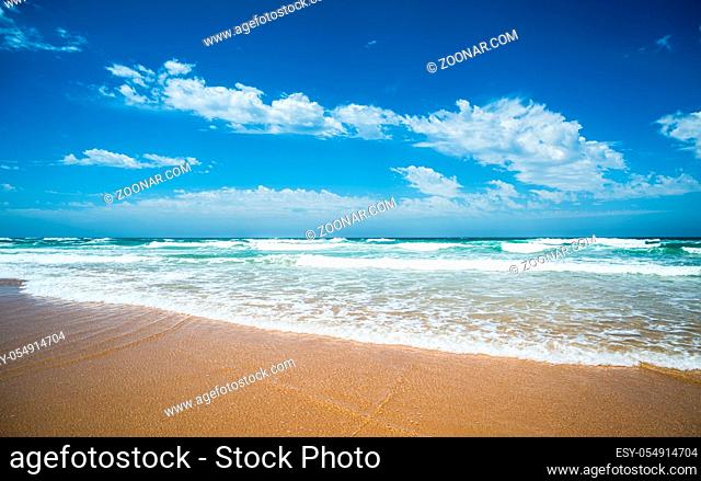 Yellow sand beach, sea and deep blue sky