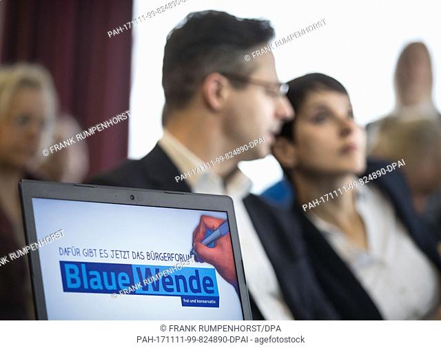 Former AfD leader Frauke Petry (R) and her husband and former AfD head in North Rhine-Westphalia, Marcus Pretzell (L), sitting together behind a laptop during a...