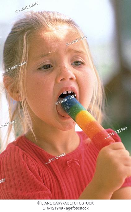 Young girl enjoying popsicle
