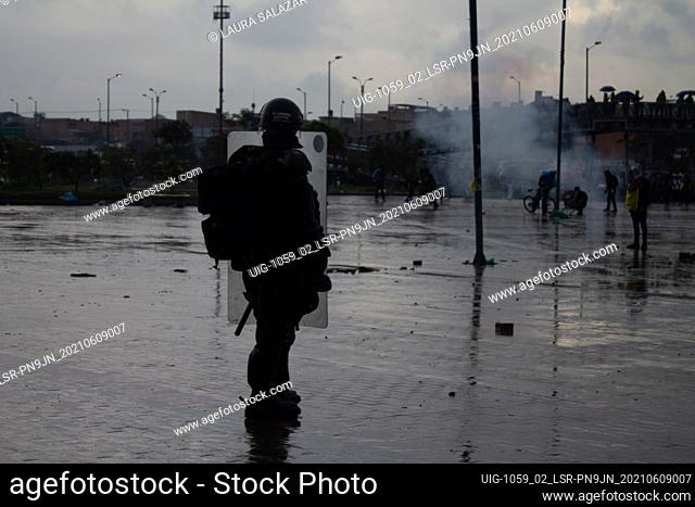 A Colombian riot police officer during clashes with demonstrators as demonstrations turned into clashes in southern Bogota at Portal de las Americas so-called...