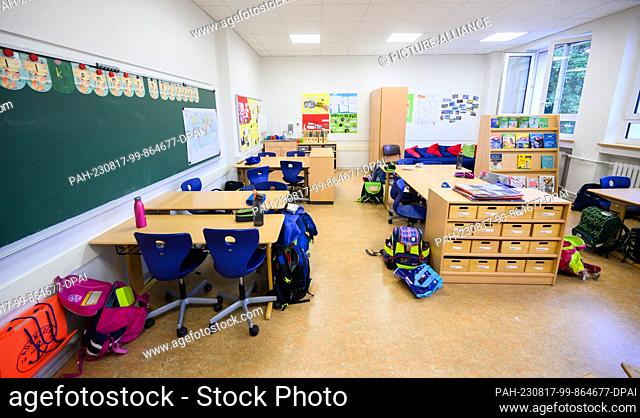 17 August 2023, Lower Saxony, Hanover: School bags stand in the classroom of a 4th grade class at an elementary school in the Hanover region during the big...