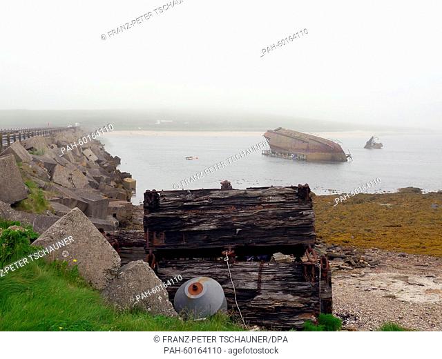 Rusty ship hulls protrude from the water in Scapa Flow on the Orkney Islands, Britain, 16 June 2014. Ships of the British navy were blocking the access area to...
