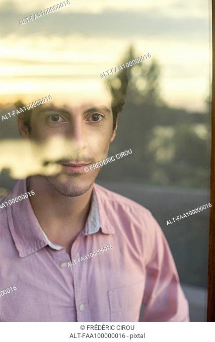 Man looking introspectively at view