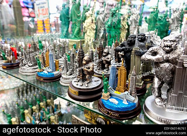 New York, United States - September 20, 2019: Collection of small statue for sale in a souvenir shop in Manhattan