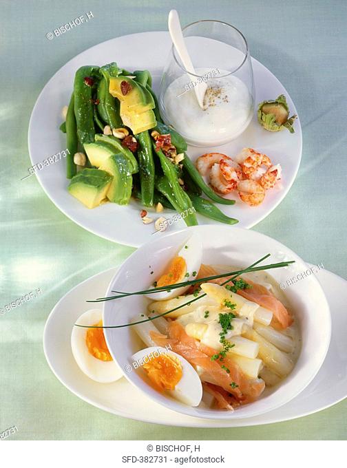 Bean salad with avocado and cray fish and an asparagus salad with smoked salmon