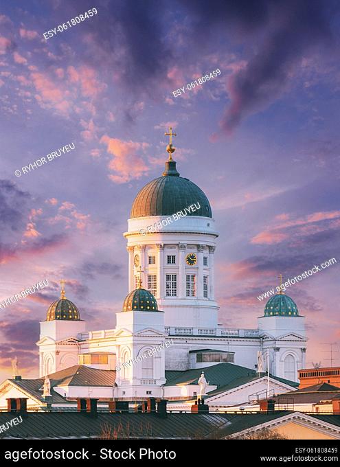 Helsinki, Finland. Very Peri Cloudy Sky Above Lutheran Cathedral On Senate Square. Famous Landmark In Finnish Capital. Bright Dramatic Light Purple Sky