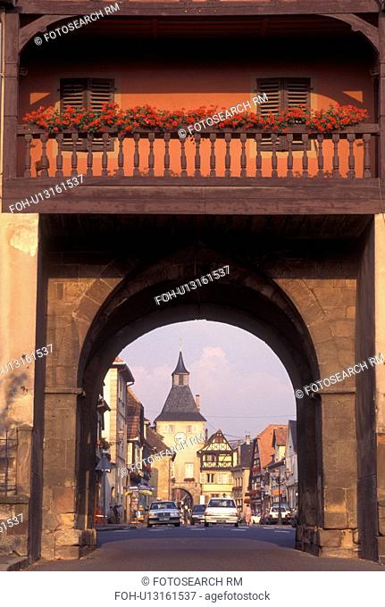 France, Alsace, Rosheim, Bas-Rhin, Europe, wine region, Gateway arch decorated with flowers at the entrance to the picturesque village of Rosheim in the wine...