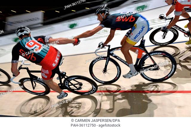German cyclist Robert Bartko (L) and Dutch Peter Schep in action at the 49th Bremen six-day race at OEVB-Arena in Bremen, Germany, 10 January 2013