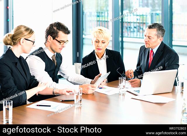Business - meeting in office, the businesspeople or lawyers in team are discussing a document on Laptop computer