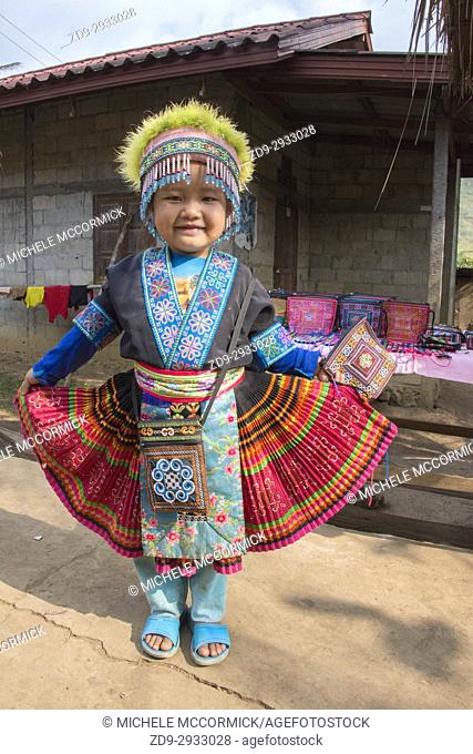 A young girl in traditional Hmong dress in Laos near the Mekong River. 3/16