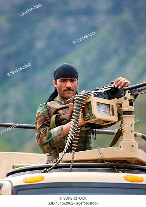 Afghan National Army Soldier Behind a Machine Gun