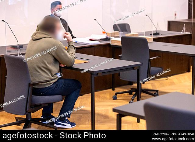 25 April 2022, Bavaria, Nuremberg: An accused man (l) sits in the courtroom of the Criminal Justice Center of the Nuremberg-Fürth Regional Court at the start of...