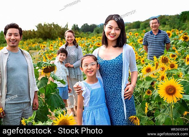 Standing in the flower sea happiness family