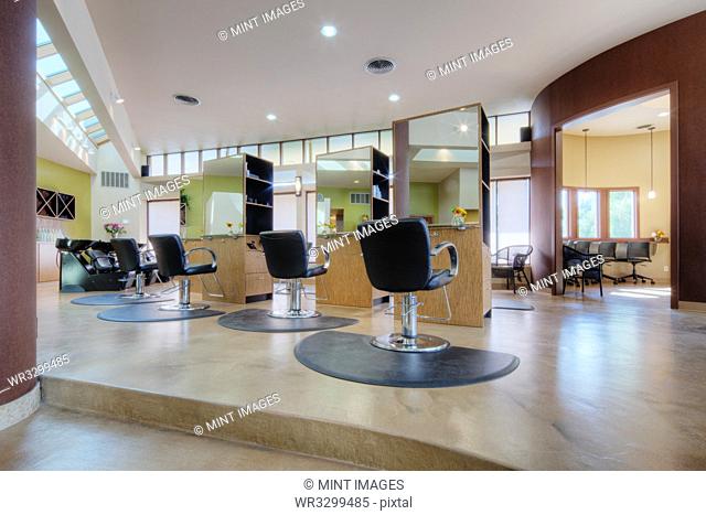 Chairs and stations in empty beauty salon