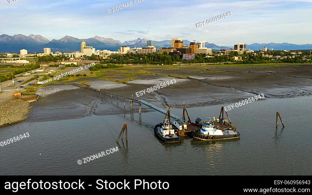 Tug boats are moored at a private dock near Fish Creek in the Coook Inlet Alaska