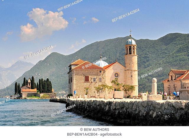 Our Lady of the Rock island and Church in Perast on shore of Boka Kotor bay (Boka Kotorska) Montenegro Europe