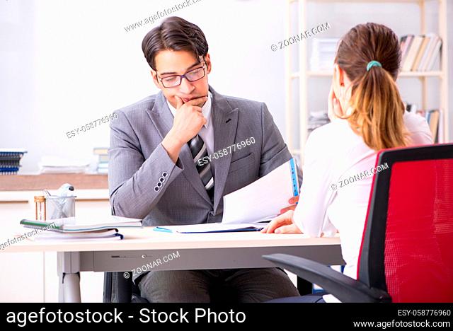 Man and woman discussing in office