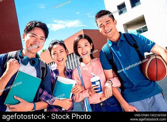 Two couples on the campus of university students