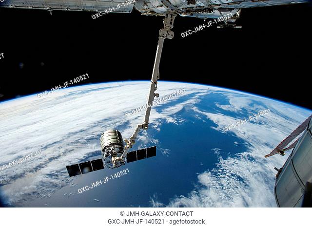 The International Space Station's Canadarm2 prepares to release the Orbital Sciences' Cygnus commercial cargo craft after a month visiting the orbital outpost