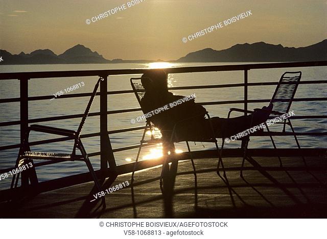 Norway, Midnight Sun on the deck of the Coastal Steamer