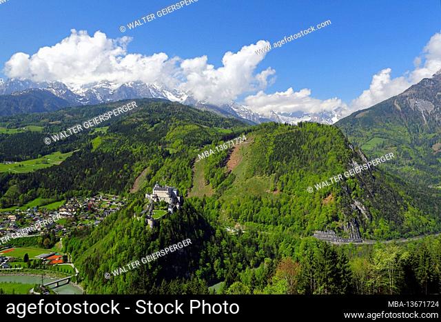 Hohenwerfen Castle with the market town of Werfen and Hochkönig Mountains with clouds in landscape format