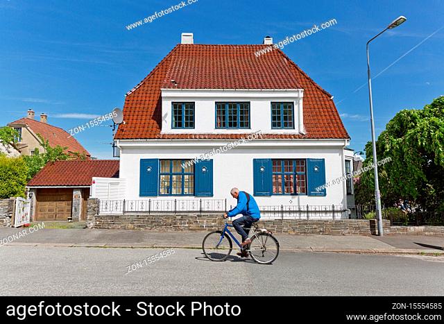 STAVANGER, NORWAY - JUNE 01, 2017: People walking through traditional streets of Stavanger in Norway, which is one of most famous cruise travel destinations in...